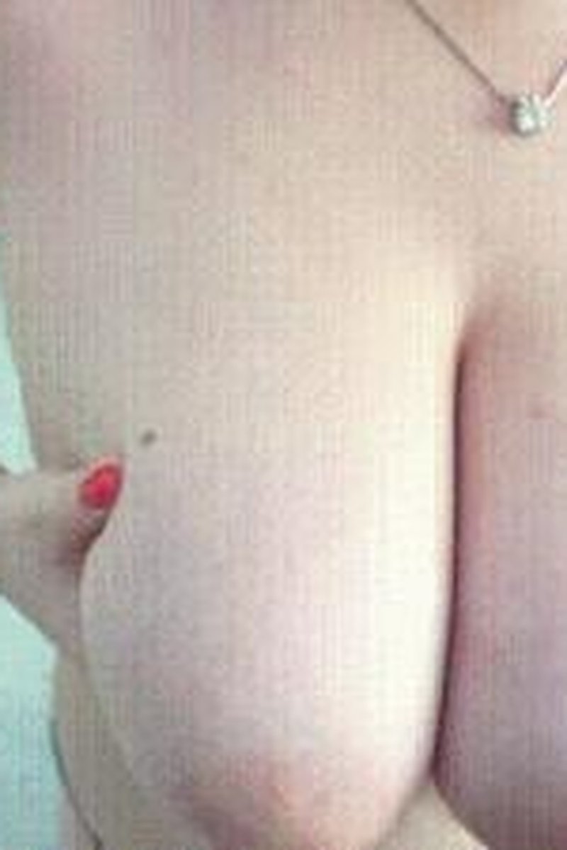 Paddle Spanks On Huge Tits - Screenshot 1 of 4 - Big Tits