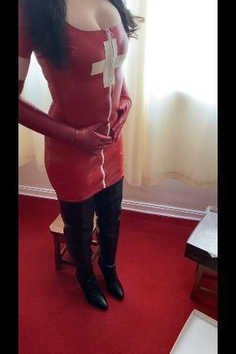 Boots Tease Wearing Nurse Latex - Screenshot 1 of 4 - Boots