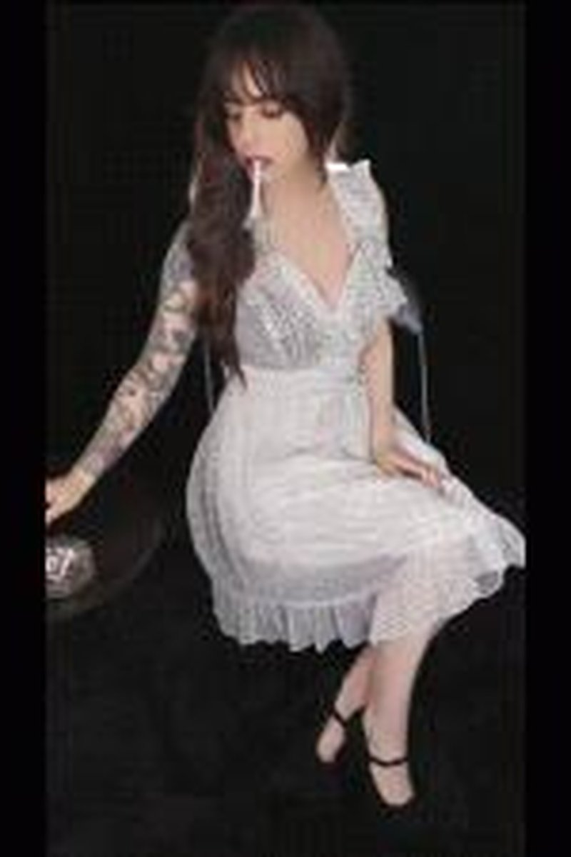 Smoking In White Polka Dot Dress - Screenshot 1 of 4 - Cigarette
