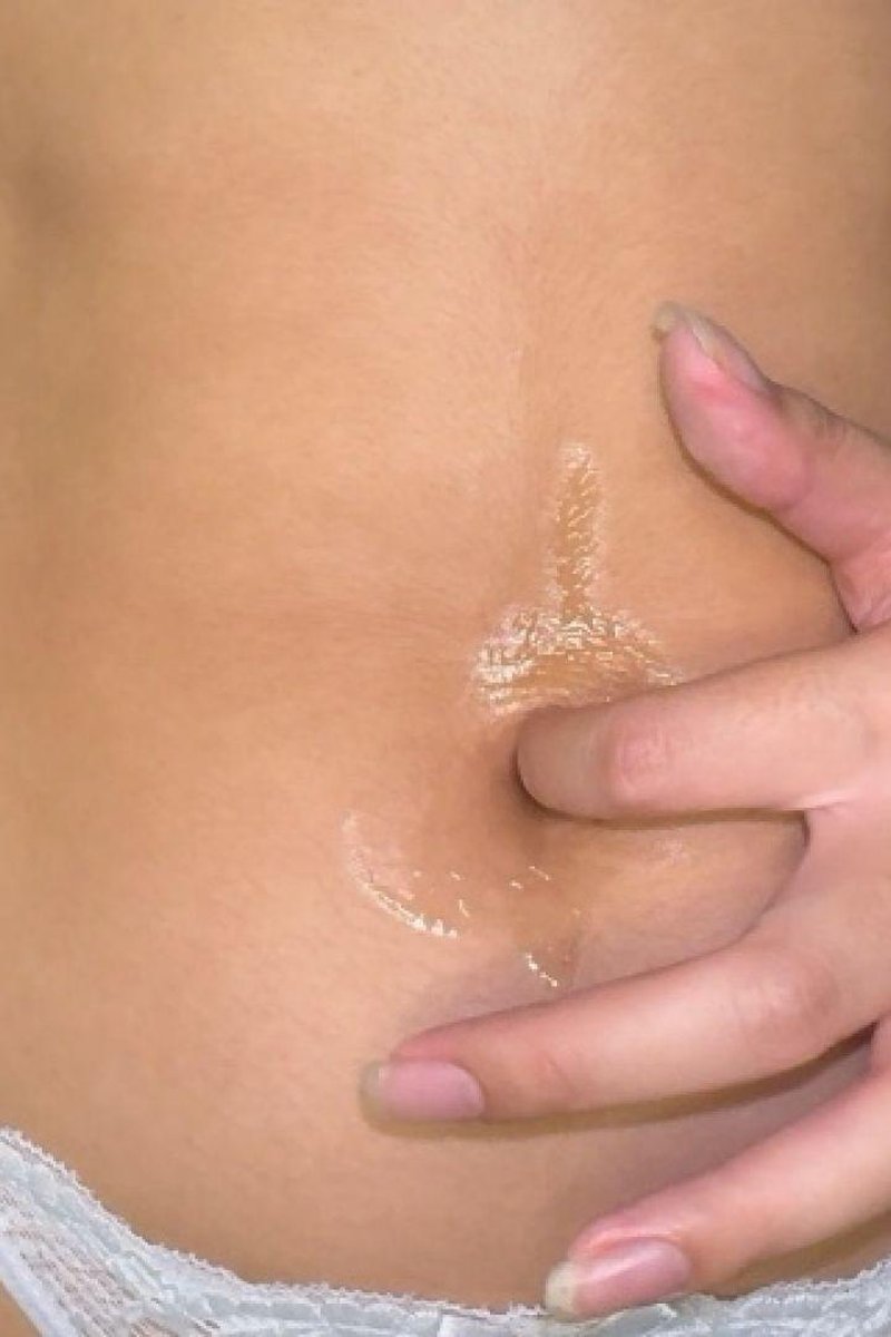 Close-Up Belly Button Cleaning With Oil And Q-Tip - Screenshot 1 of 4 - Belly Fetish