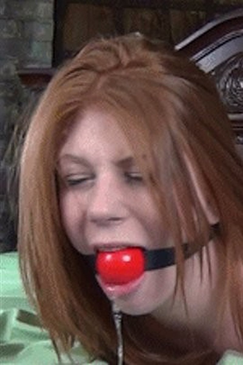 Red Ball Gag for the Redhead Madelyn Rose - Screenshot 1 of 4 - Bondage