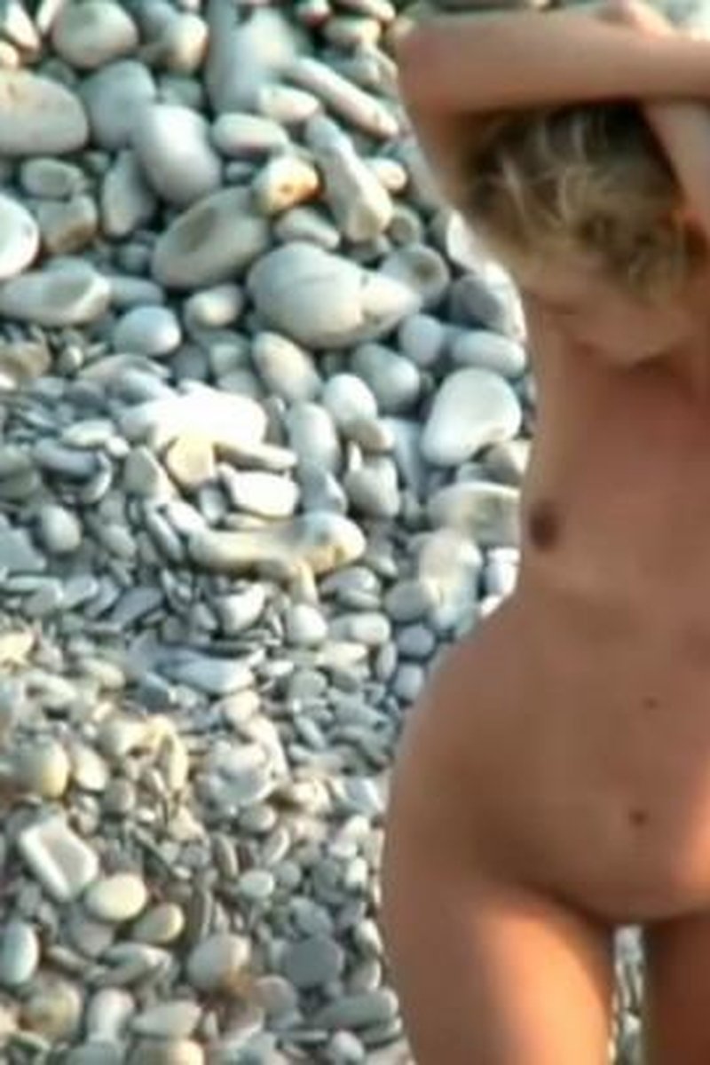 Playful MILF Teasing Her Husband - Screenshot 1 of 4 - Beach