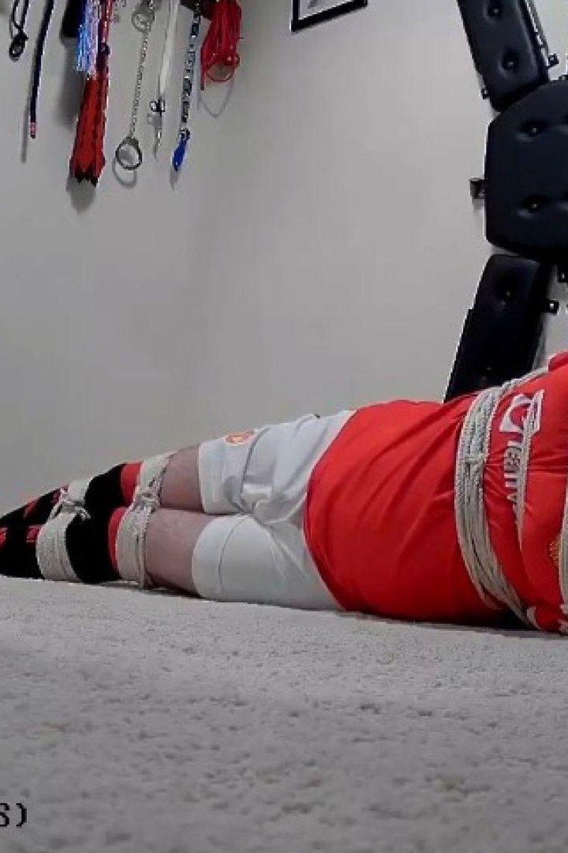Miss M Keeps Man Tied Up In Manchester United Football Kit - Screenshot 1 of 4 - Bondage